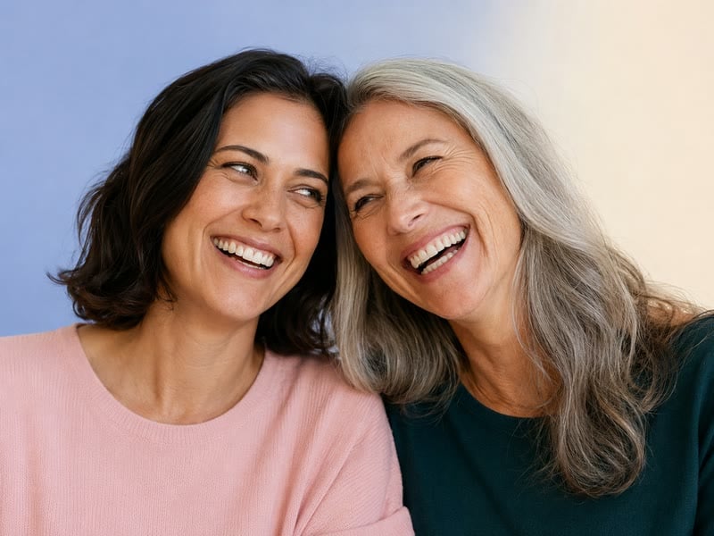 Two women laughing together